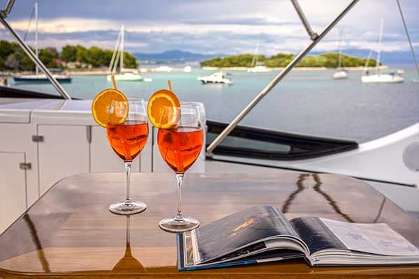 Crewed charter — guests relaxing on the deck of a luxury yacht in Croatia