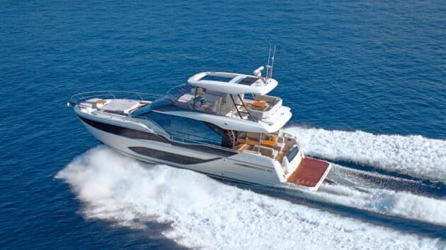 A family flybridge motor yacht under way, seen from above