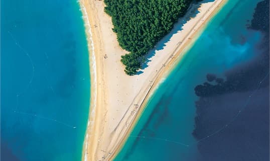 The Zlatni Rat spit at Bol from directly above, a pale shingle tongue running out between two shades of turquoise water